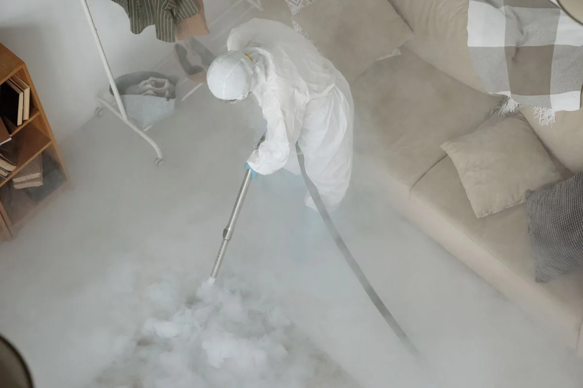 Biohazard cleanup technician in protective equipment, Clay, AL